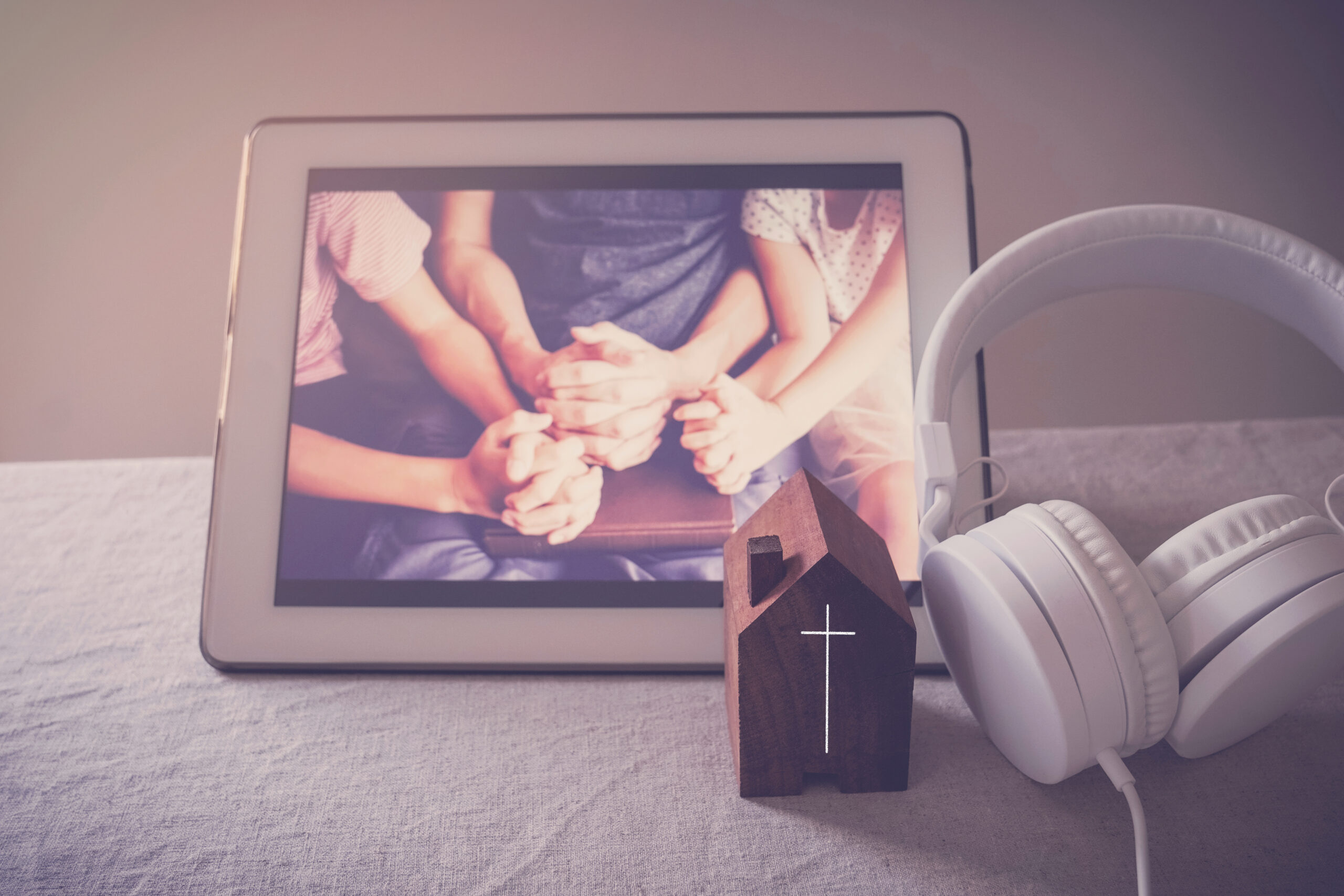 Children praying with father parent with laptop, family and kids worship online together at home, streaming online church service, social distancing concept