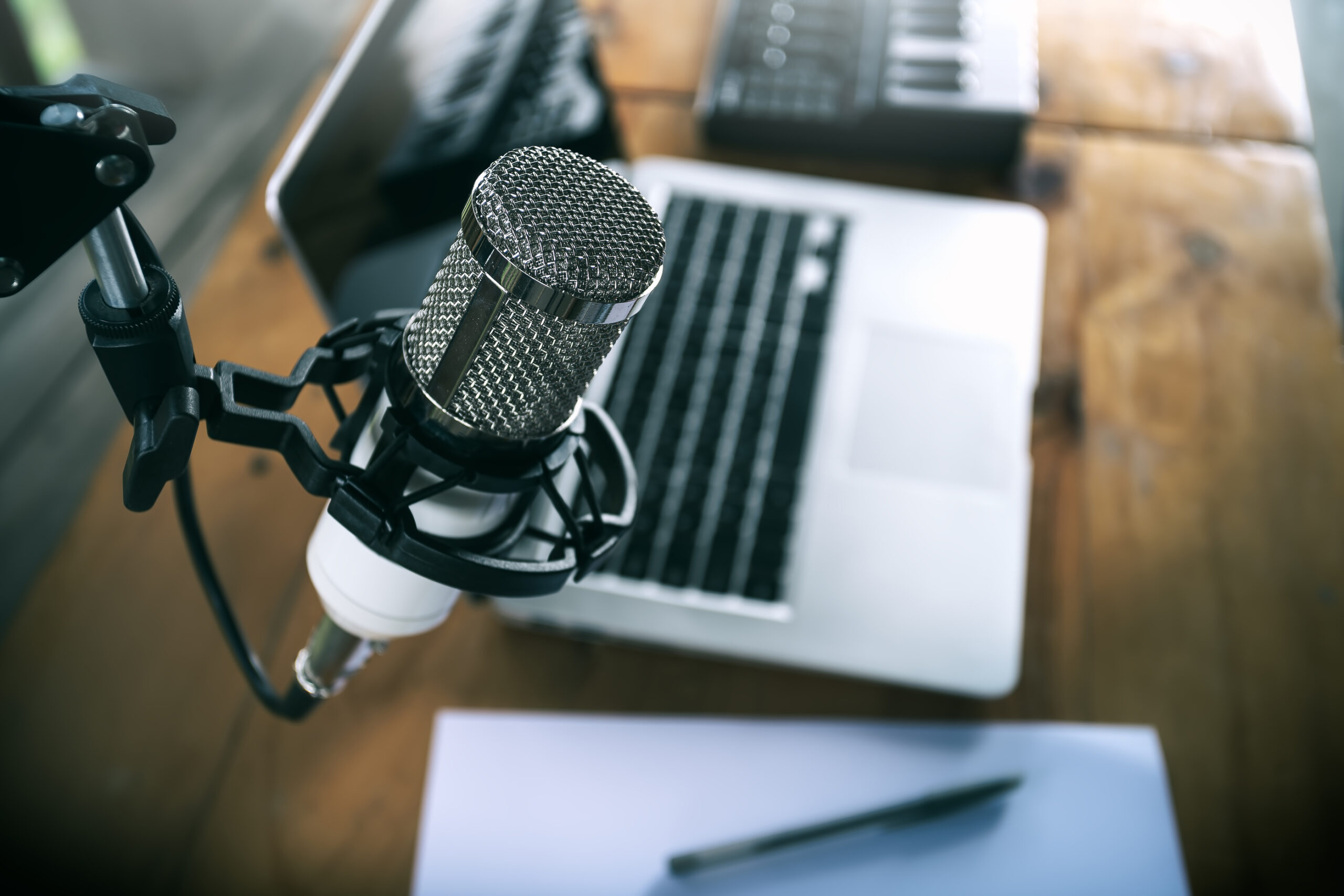 Close up a microphone with the laptop in the background, Home studio concepts.