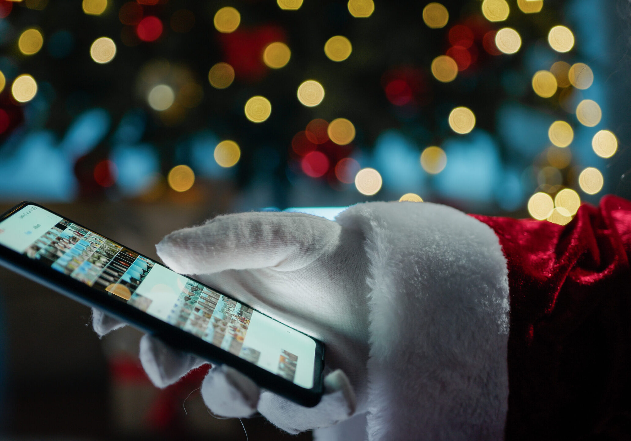 Santa Claus searching on his photo gallery
